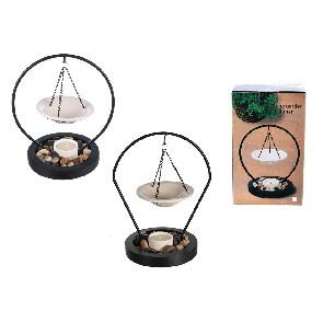Ceramic bowl hanging on metal stand on black wooden bowl with deco stones & tealight